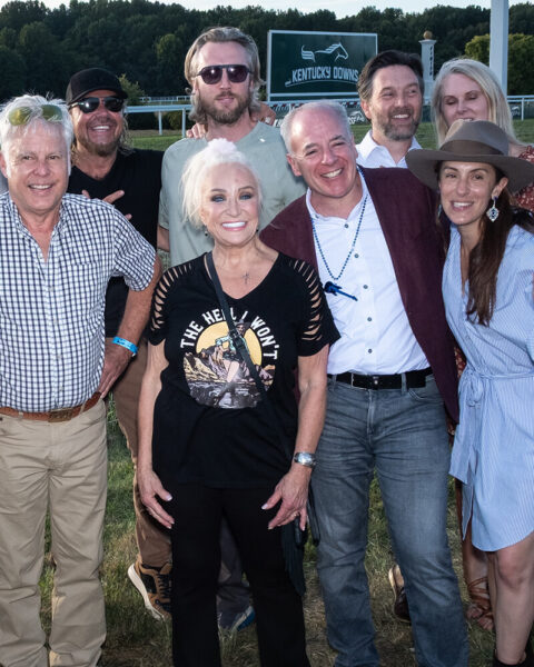 Tanya Tucker posting for photo with fans at NTL event