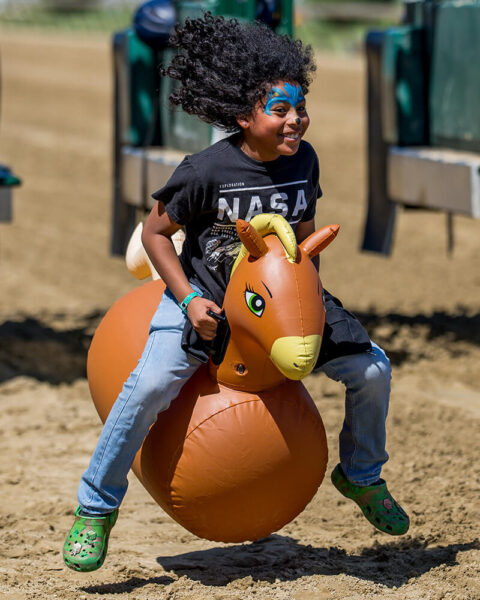 Kids bouncing horse race at NTL event