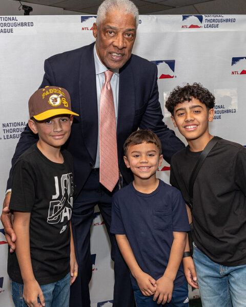 Julius "Dr J" Erving posing for photos at NTL event